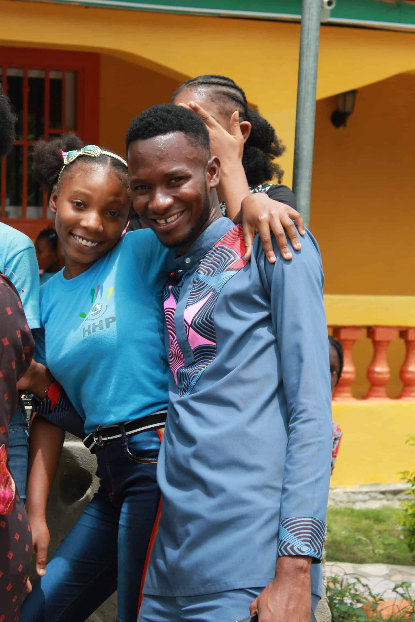 During our Summer Program, empowered student and teacher hug during recess