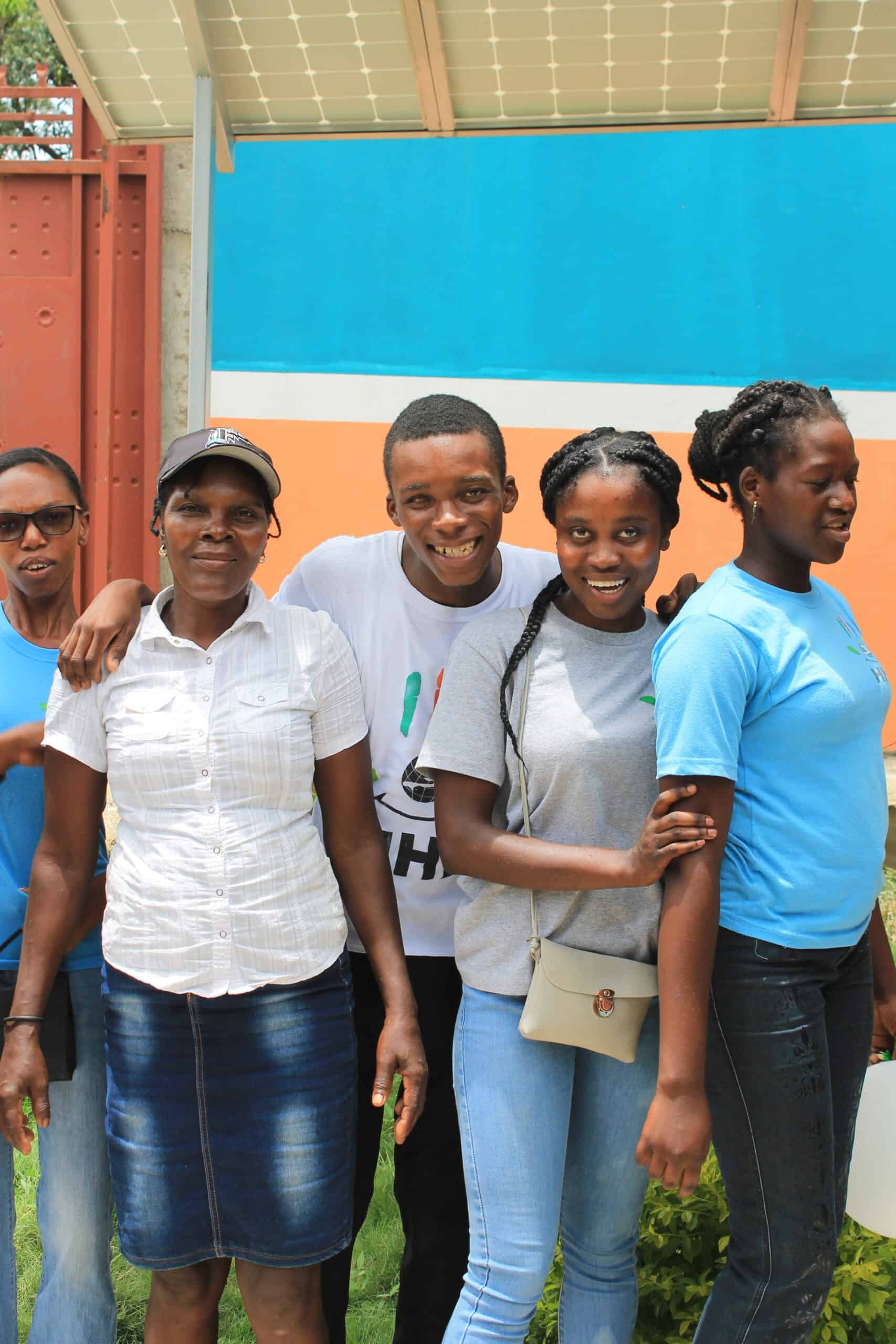 Empowered students during our summer program stand in front of school